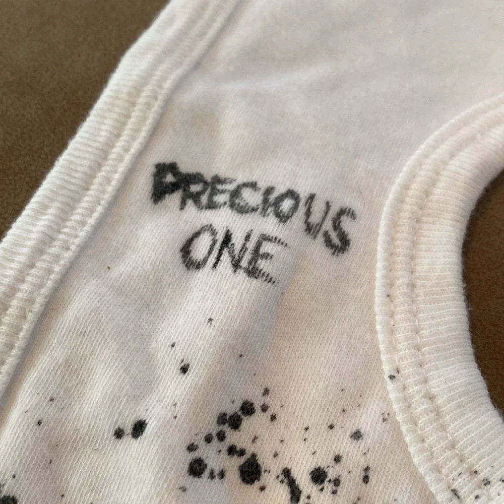 Alice in wonderland “precious one we’re all mad here!” Baby bib